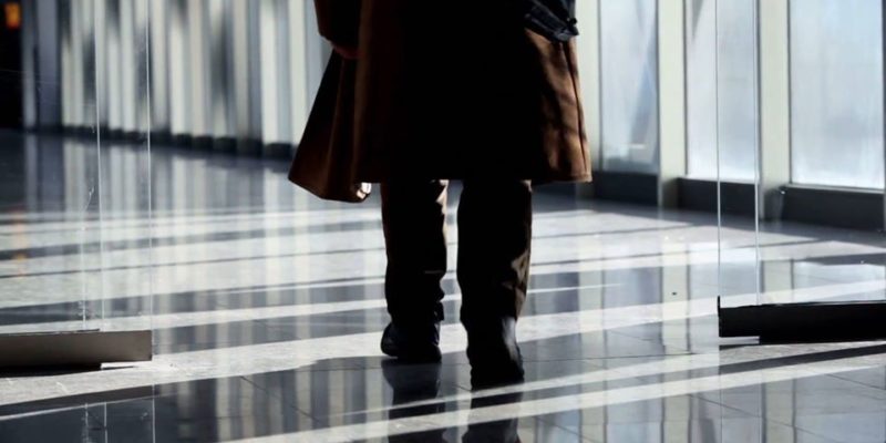 Man Walk Through Glass